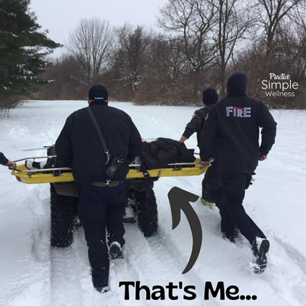Fire and rescue team in the snow with a stretcher.