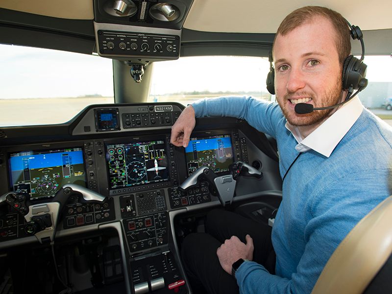 Mitch Janssen in an Embraer Phenom 100 jet.