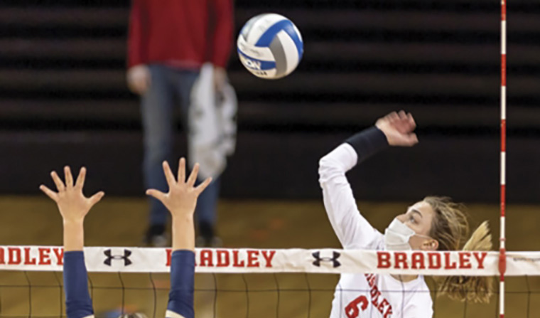 Hannah Thompson going jumping for the volleyball