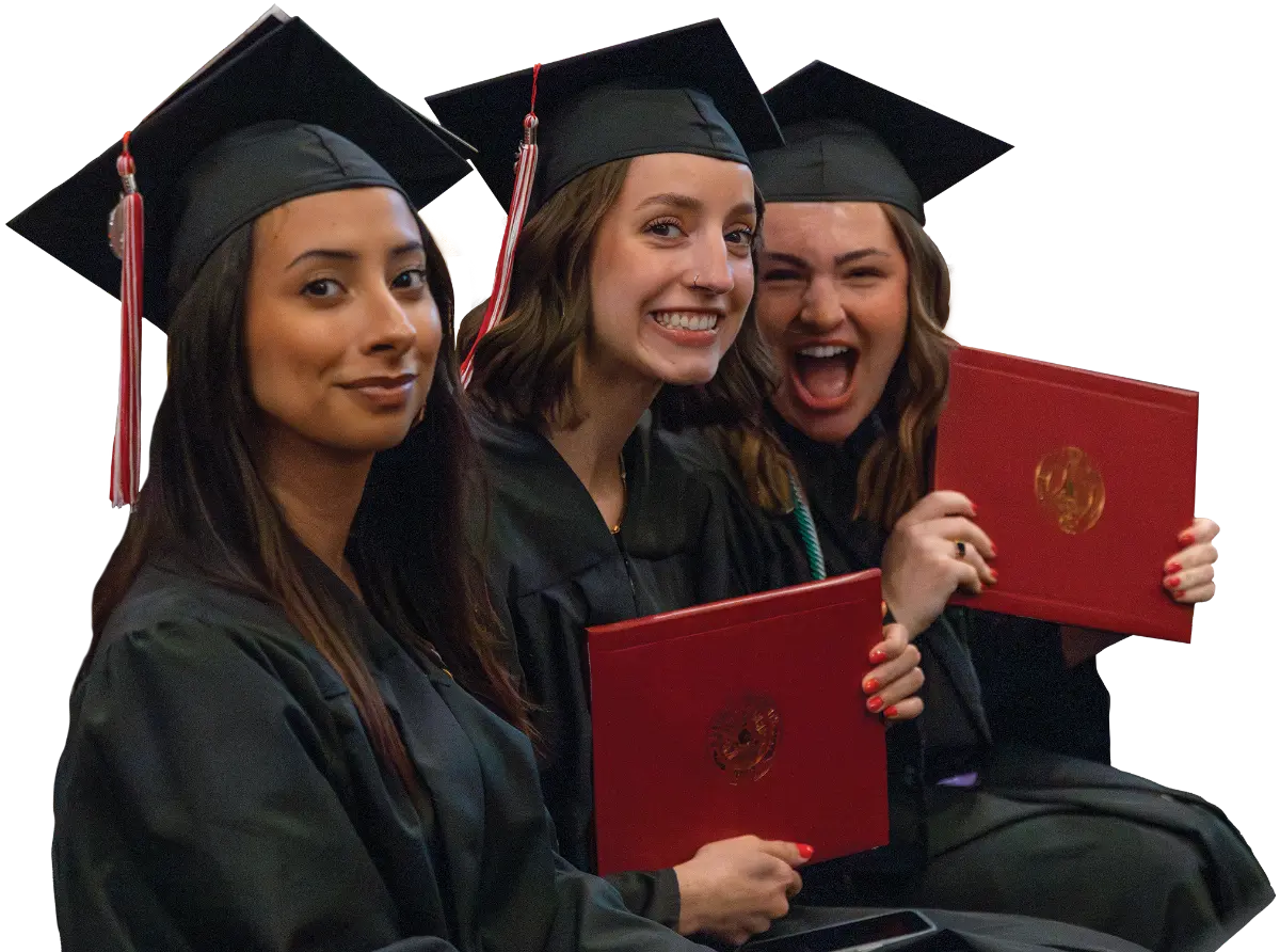 3 female graduates holding up their diplomas