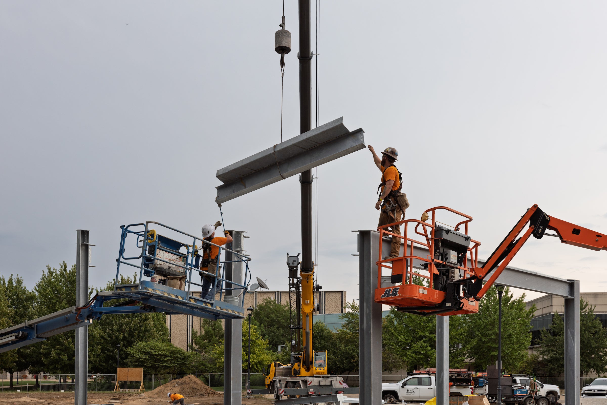 construction workers working with a crane