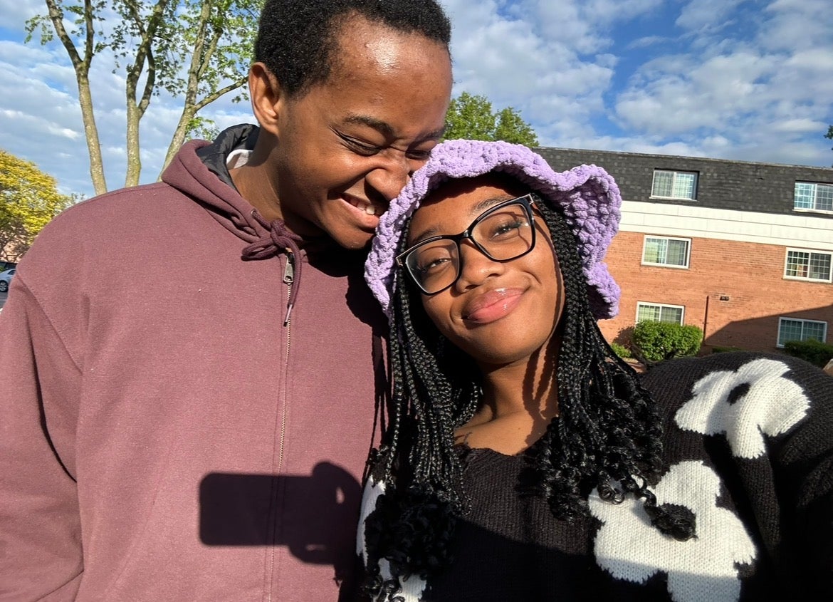 Nduka takes a selfie in a crocheted hat with her brother.