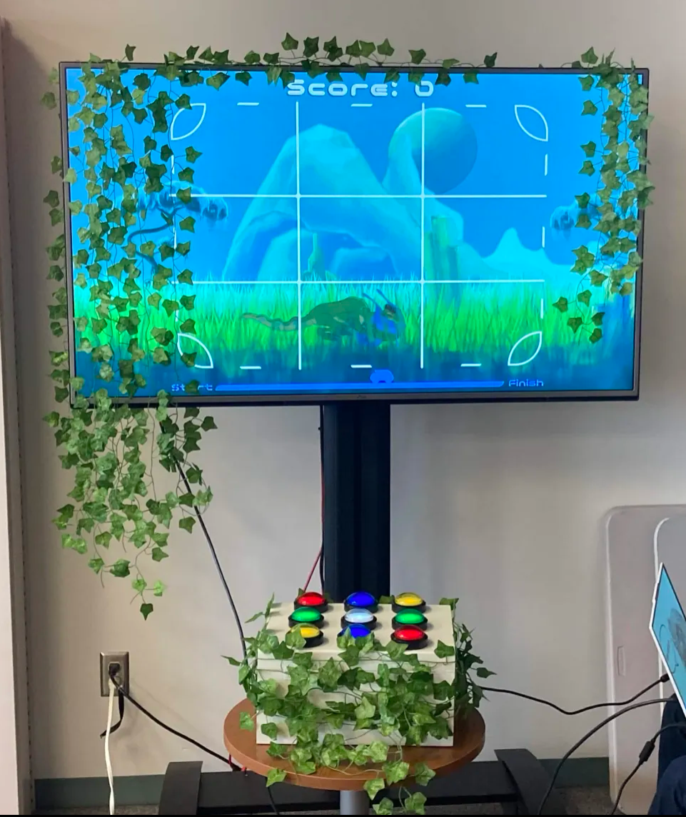 Video screen with custom nine button controller attached.