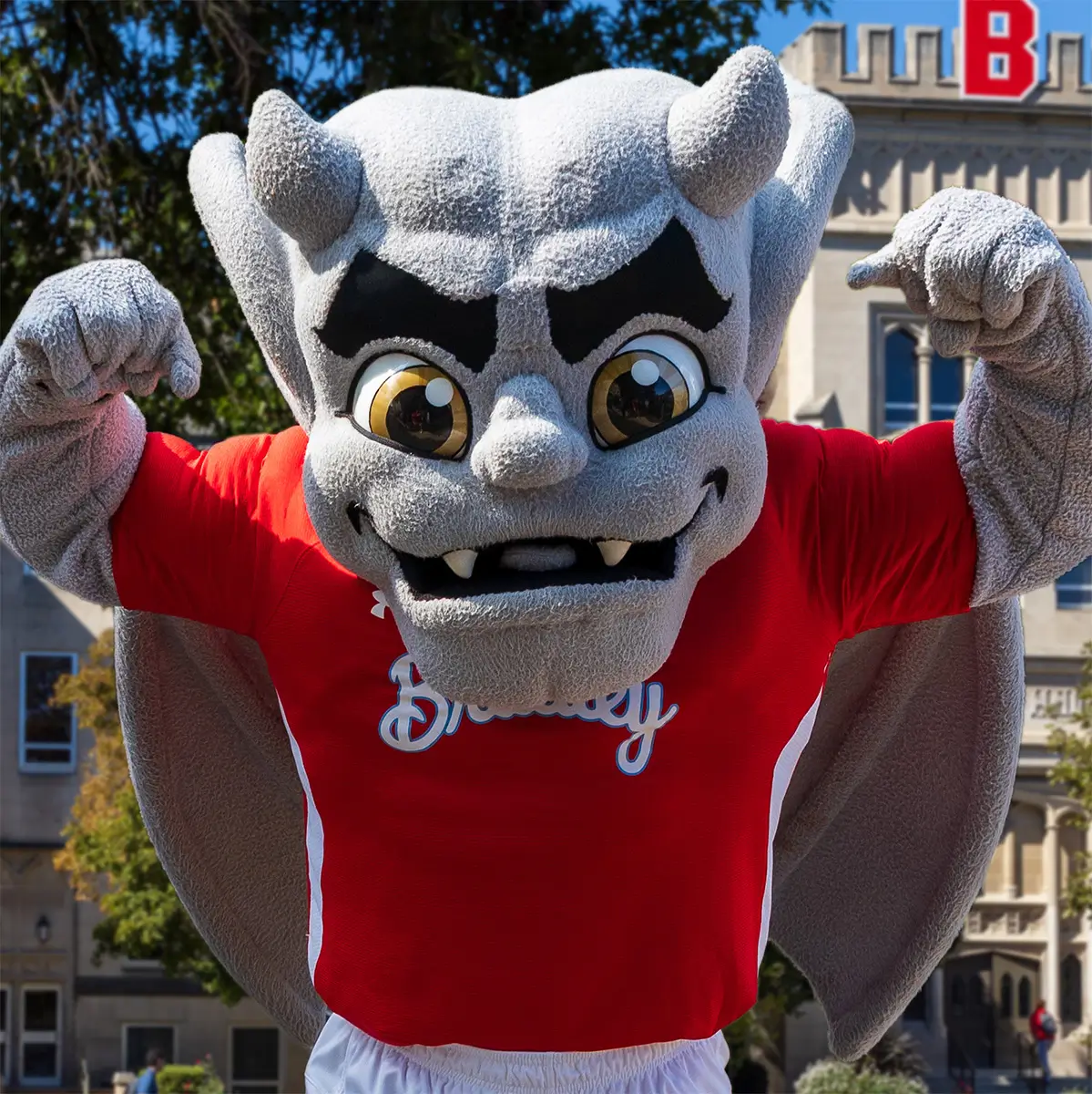 The Bradley Kaboom mascot showing off his muscles